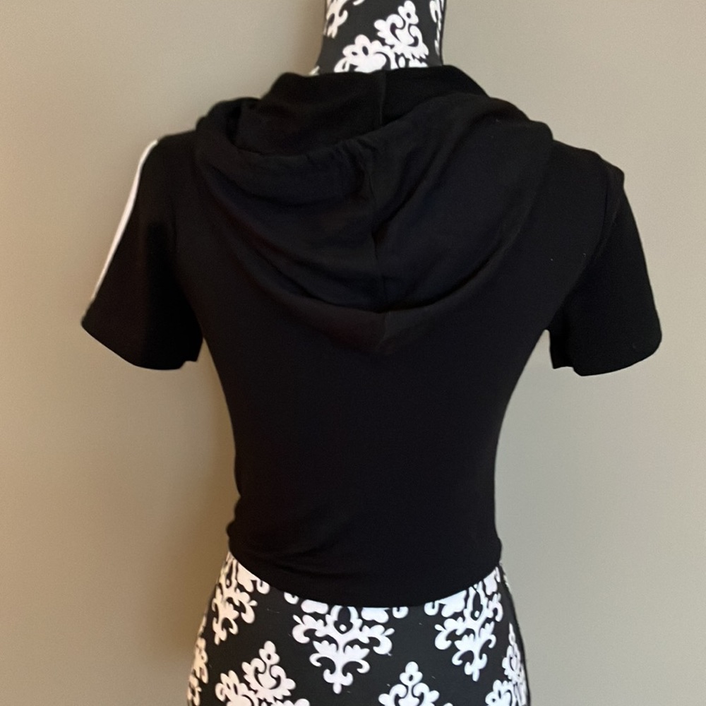 Cropped black top with hood and white stripes down each short sleeve - Picture 3 of 8